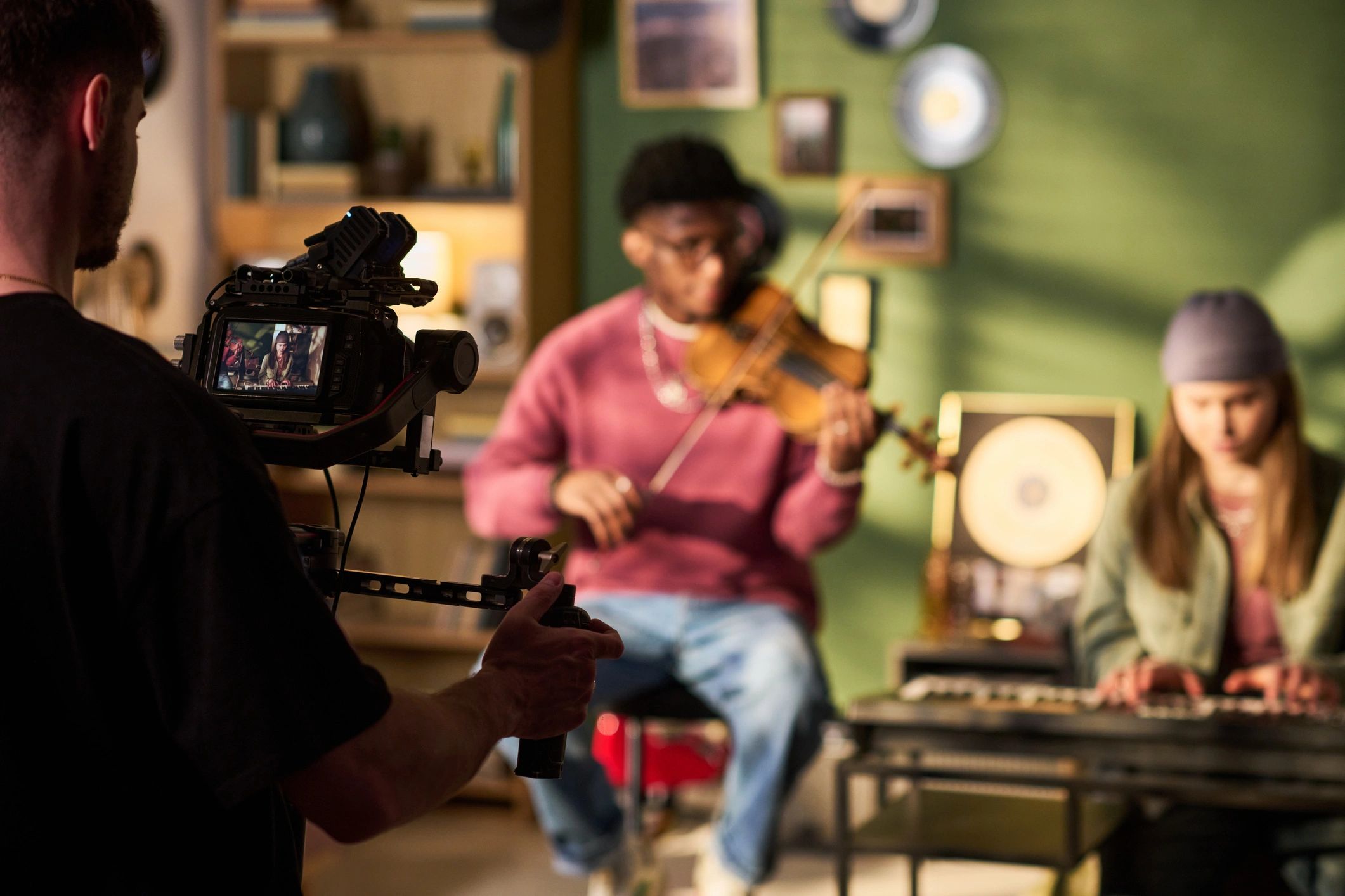 Music production session being filmed in studio